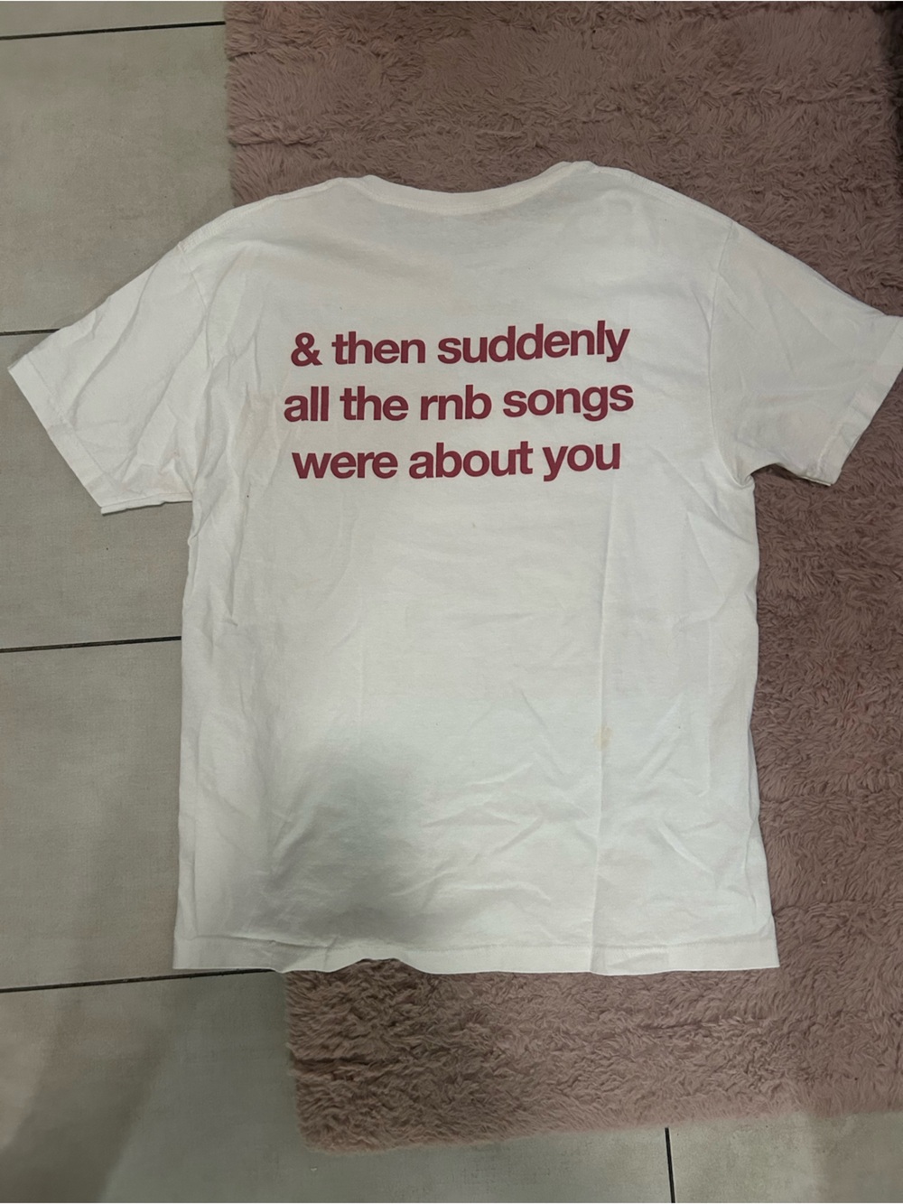 White Short-Sleeve Graphic Tee with Red 'train of thought' Text